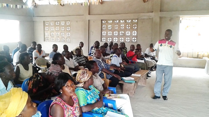 A facilitator taking some of the farmers through a training session at the Fanteakwa District Assembly